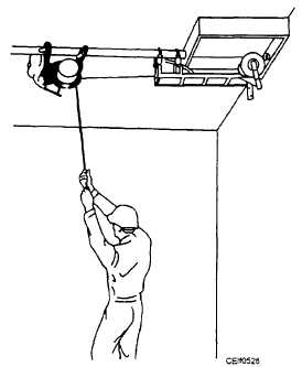 Pulling in an overhead pull box with the puller mounted independently for extra cable